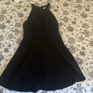 Black cocktail dress. Worn once. In great condition. 95% Polyester/5% Spandex